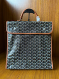 Designer tote bag with Goyard-style pattern, tan leather trim, top handle and flap closure