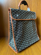 Designer tote bag with Goyard-style pattern, tan leather trim and side strap detail