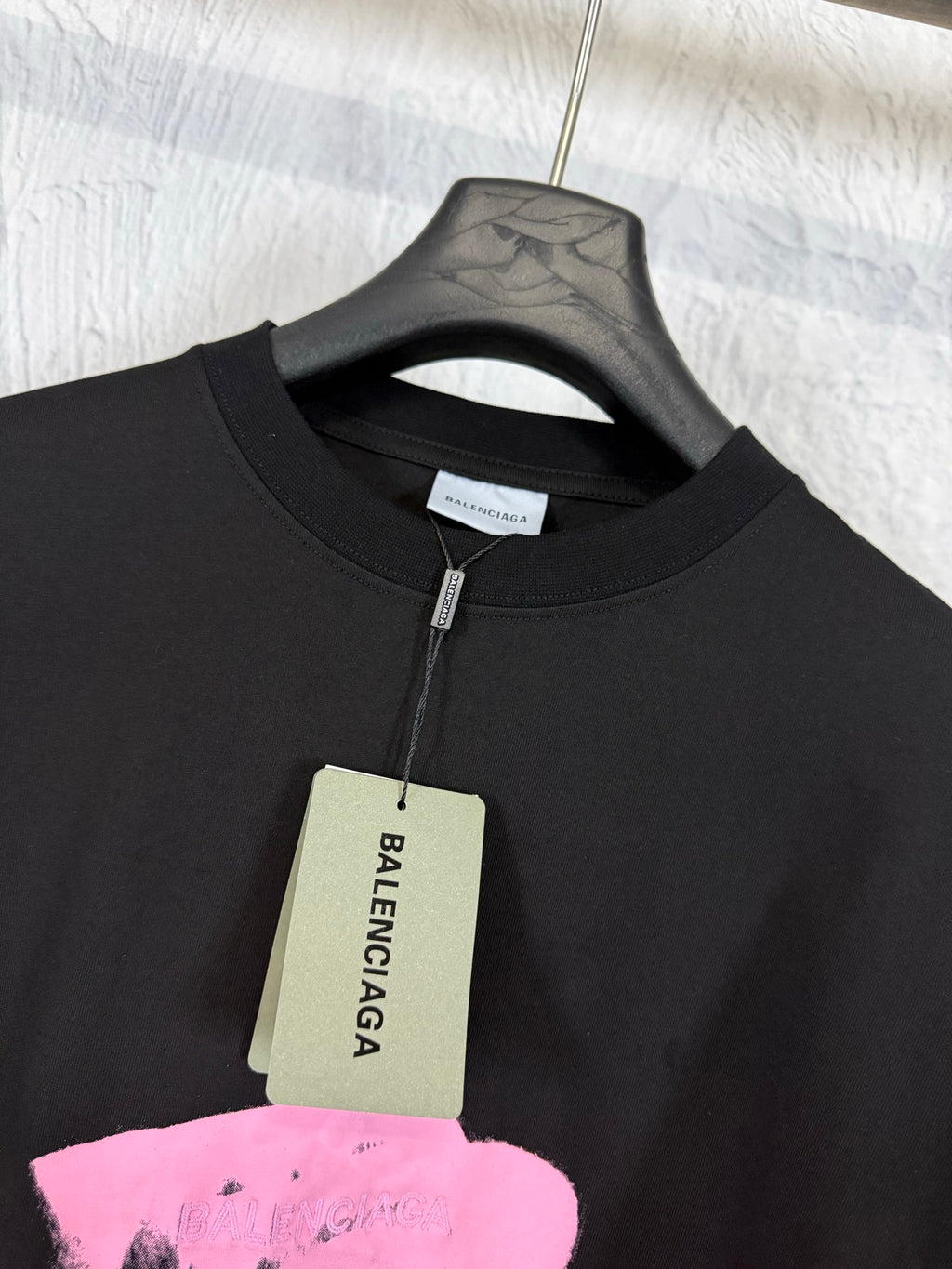 Balenciaga black T-shirt with neck tag and pink heart graphic