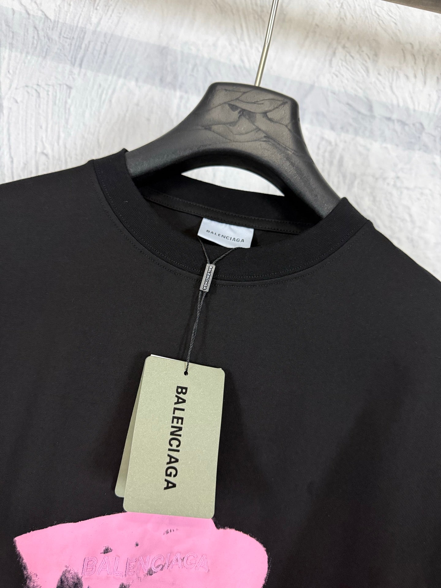 Balenciaga black T-shirt with neck tag and pink heart graphic