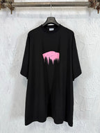 Balenciaga black T-shirt with pink graphic heart and dripping paint
