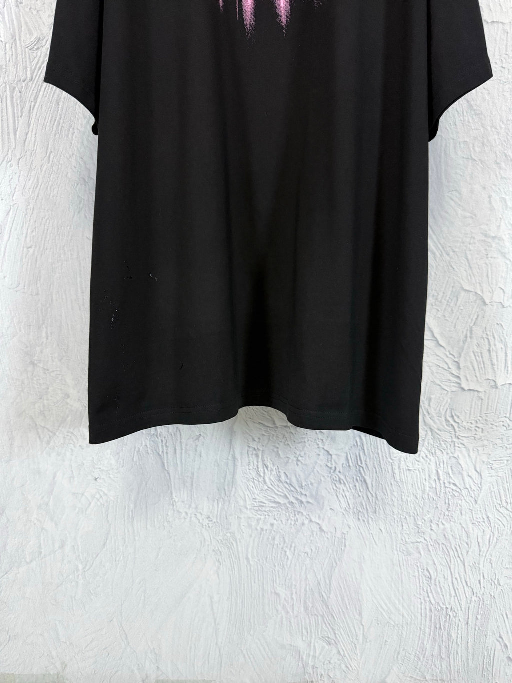 Balenciaga black T-shirt hem, cropped view