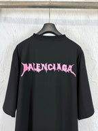 Black crew-neck short-sleeve T-shirt with large pink Balenciaga logo on the back
