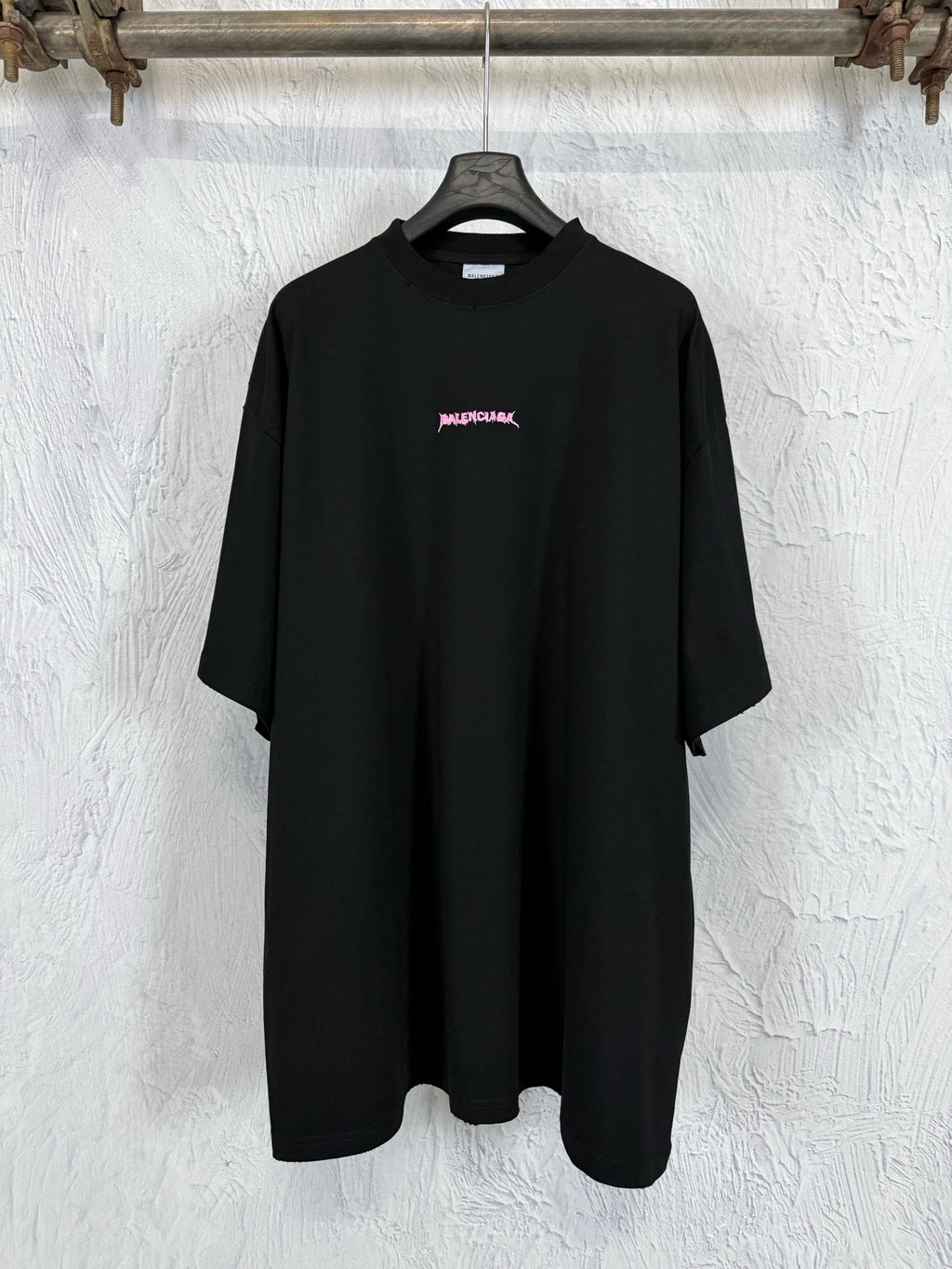 Black short-sleeve T-shirt with small pink Balenciaga logo on the chest