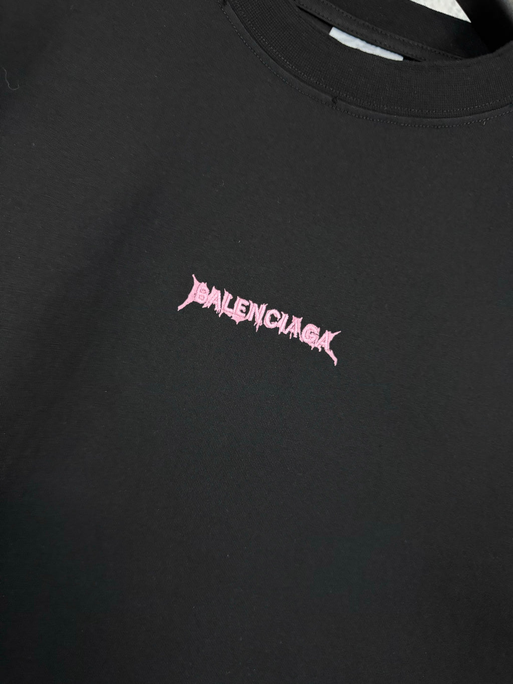 Black T-shirt chest logo detail in pink lettering