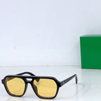 Bottega Veneta sunglasses with black frame and yellow-tinted lenses