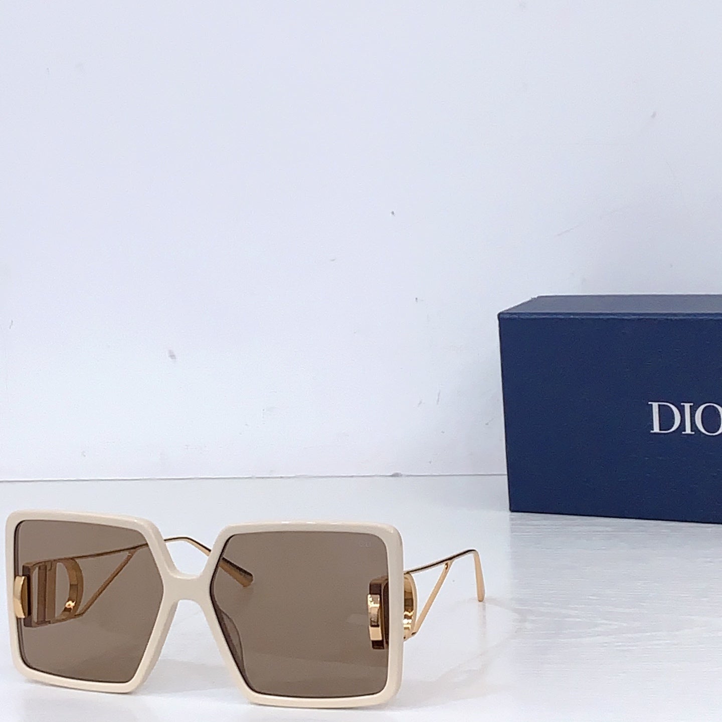 Dior sunglasses with cream oversized square frames and taupe gradient lenses
