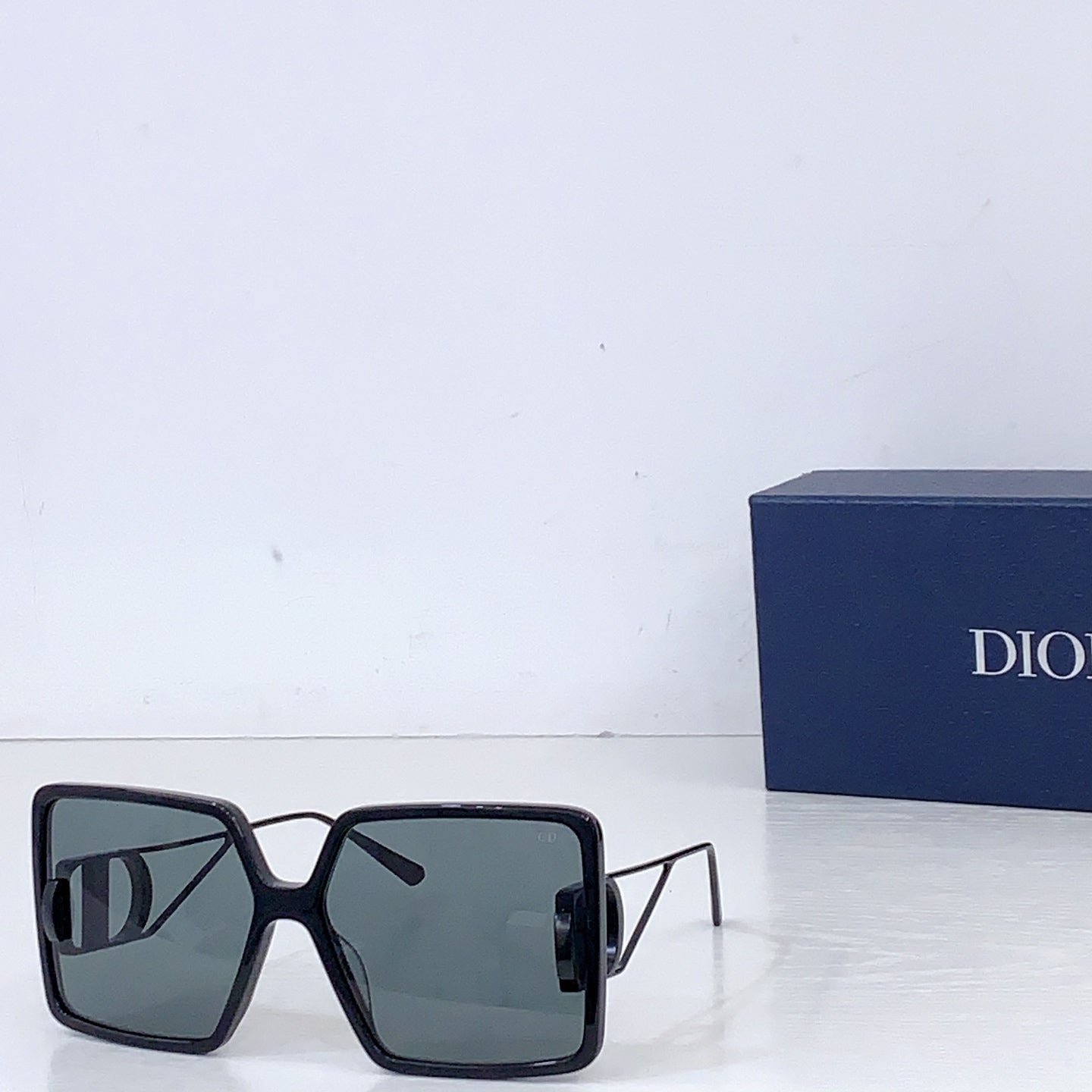 Dior sunglasses with black oversized square frames and cool gray gradient lenses