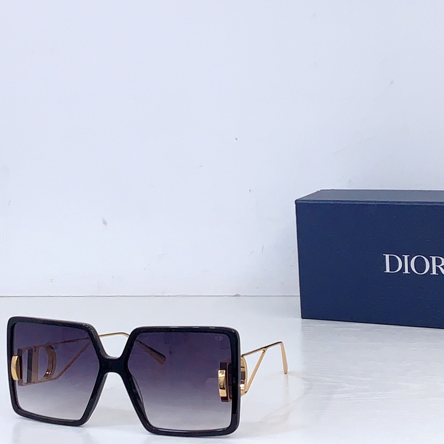 Dior sunglasses with black oversized square frames and dark gradient lenses