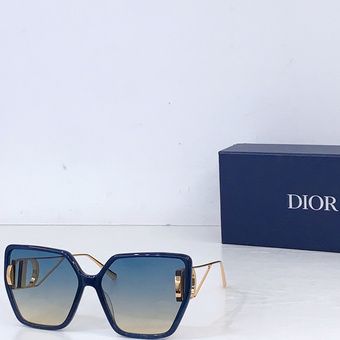 Dior square sunglasses with navy frames and blue tinted lenses
