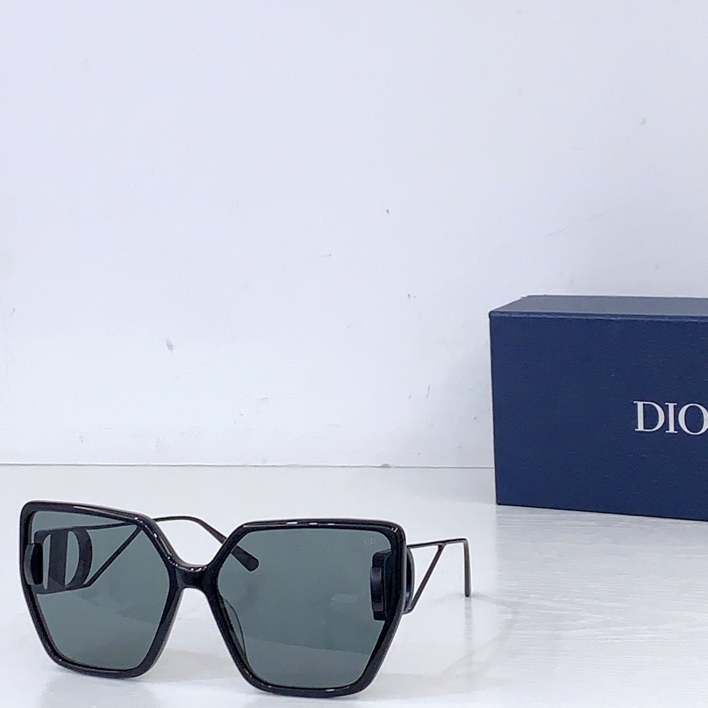 Dior square sunglasses with black frames and gray-blue tinted lenses