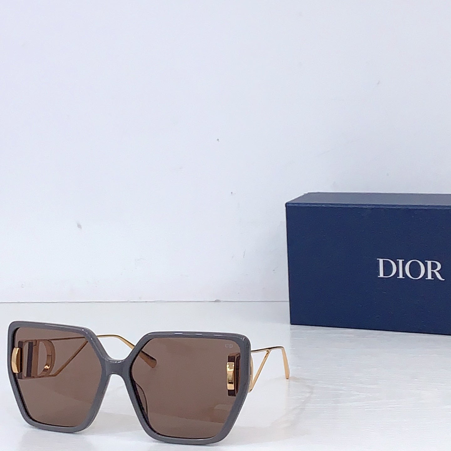 Dior square sunglasses with dark brown frames and brown tinted lenses