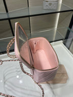 Chanel quilted mini bag in light pink shown open with zip lining and chain strap