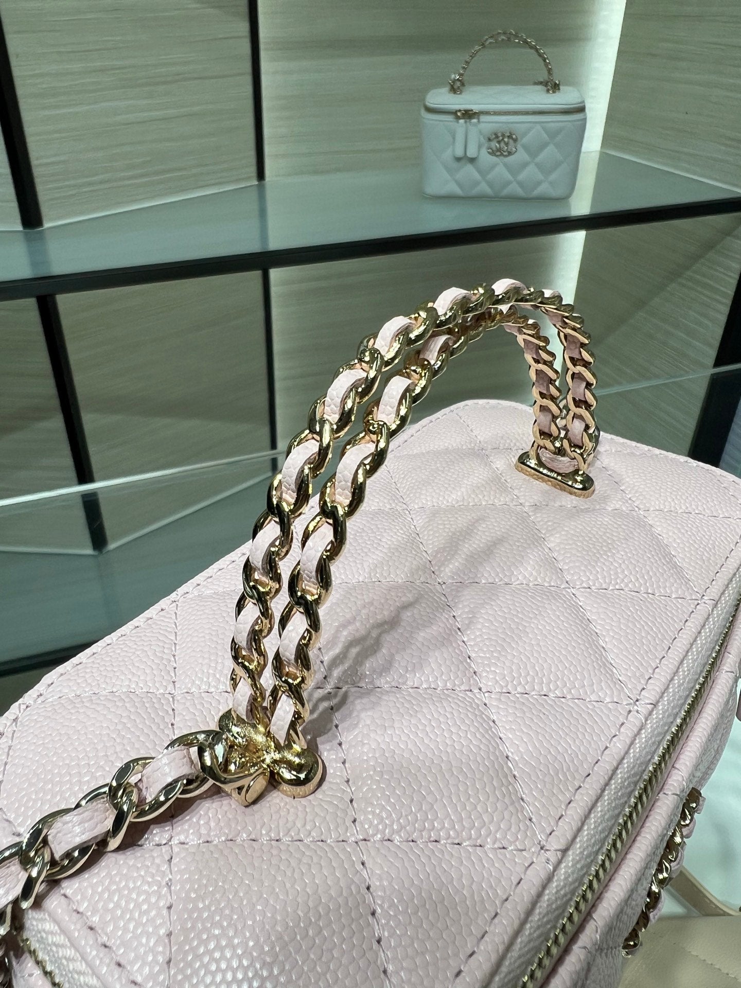 Chanel quilted bag in white with gold chain shoulder strap and top handle