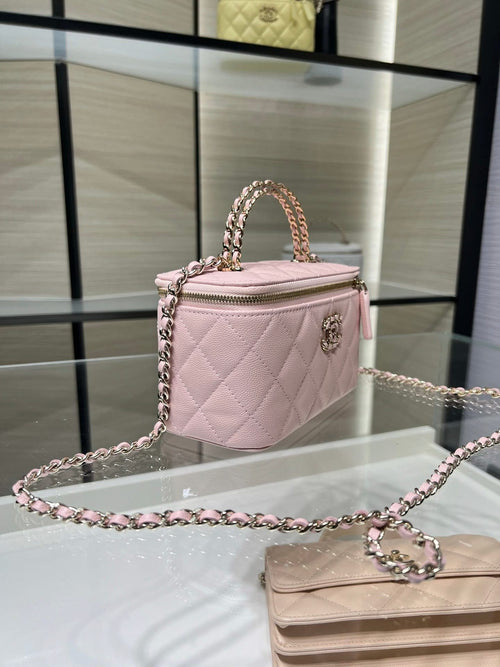 Chanel quilted mini bag in light pink with chain strap and top zipper