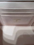 Chanel bag interior label with gold text on pale pink lining