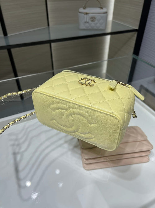 Chanel quilted crossbody bag in pale yellow with gold chain strap and flap logo