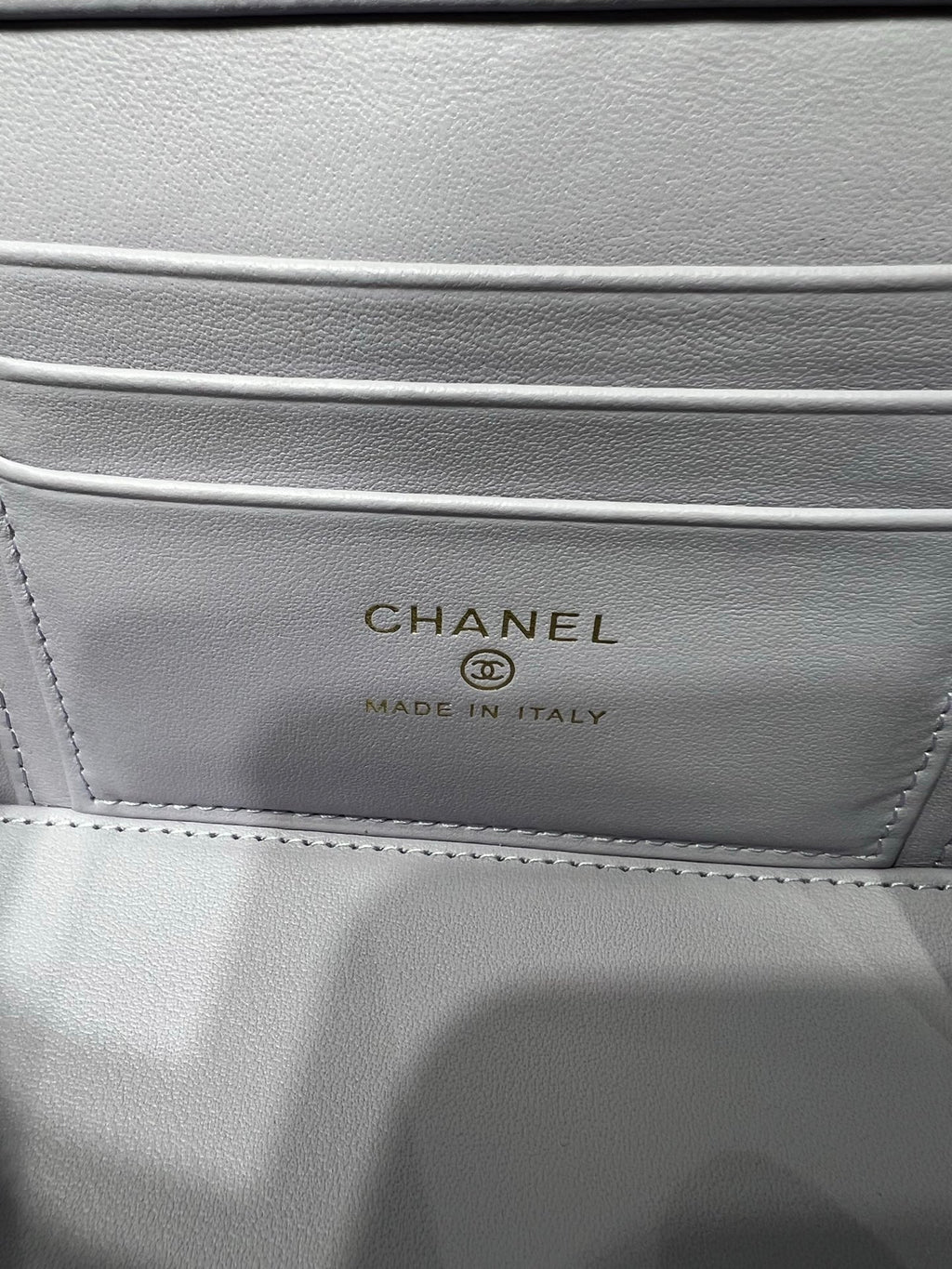 Chanel interior label reading CHANEL and MADE IN ITALY on light leather