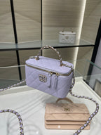 Chanel lavender mini crossbody bag with chain strap, gold zipper, and front logo emblem