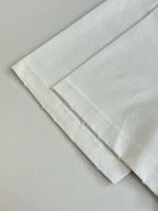 White T-shirt folded cuffs and hem with double-stitched edge