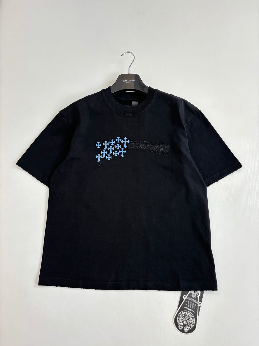 Black short-sleeve T-shirt with blue snowflake logo on front
