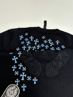 Back of black short-sleeve T-shirt with blue snowflake pattern and large emblem