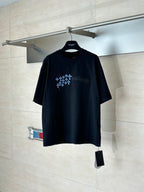 Black short-sleeve T-shirt with blue geometric snowflake logo on chest