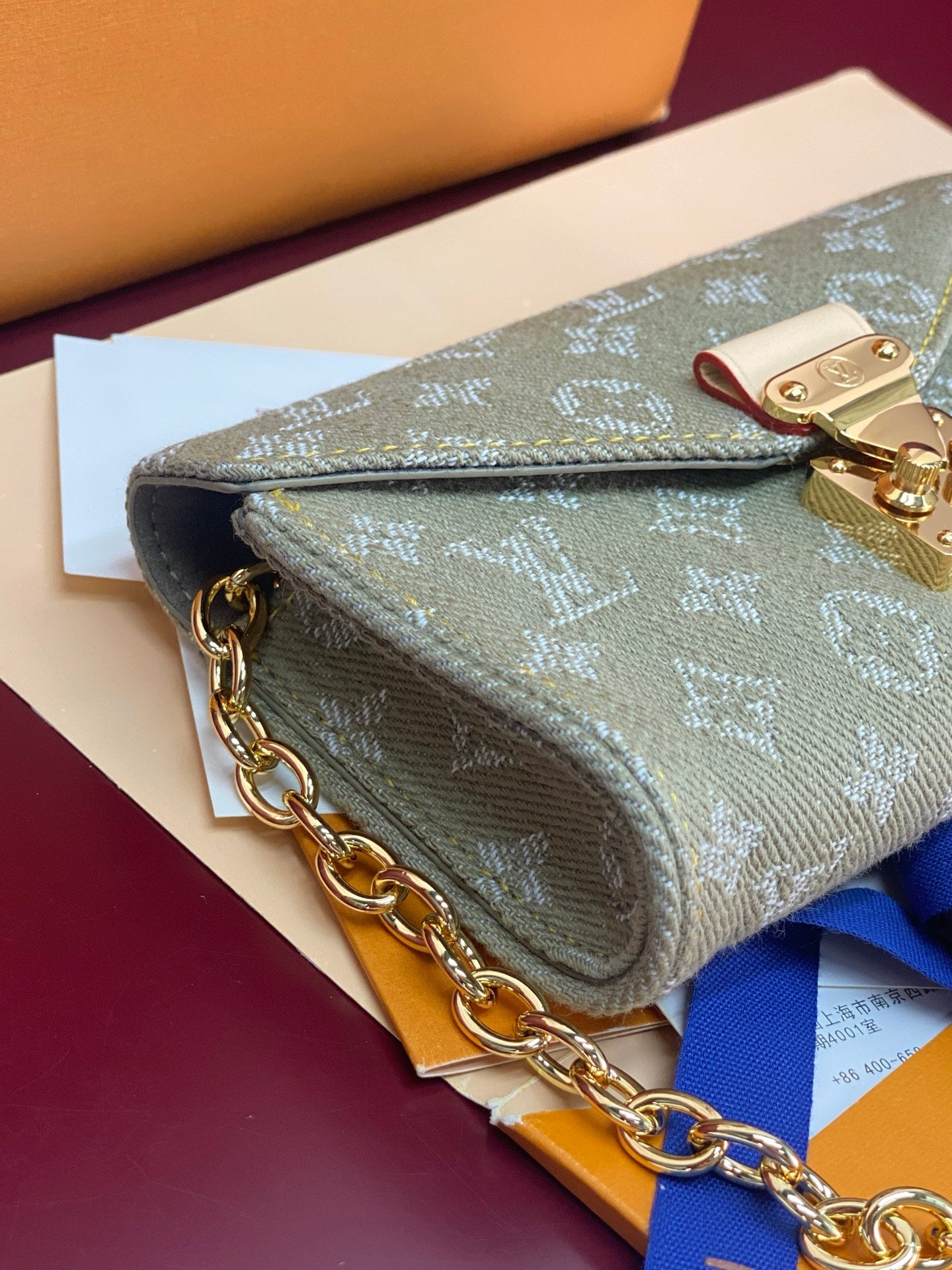 Gray-green monogram mini handbag, gold chain edge and front flap with clasp