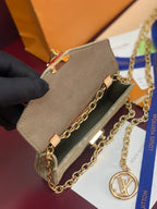 Sage monogram crossbody bag with gold-tone chain straps and clasp hardware