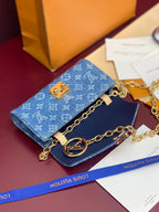 Blue monogram flap mini bag with gold chain strap and front logo hardware