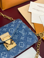 Blue monogram canvas flap mini bag with gold hardware and chain links