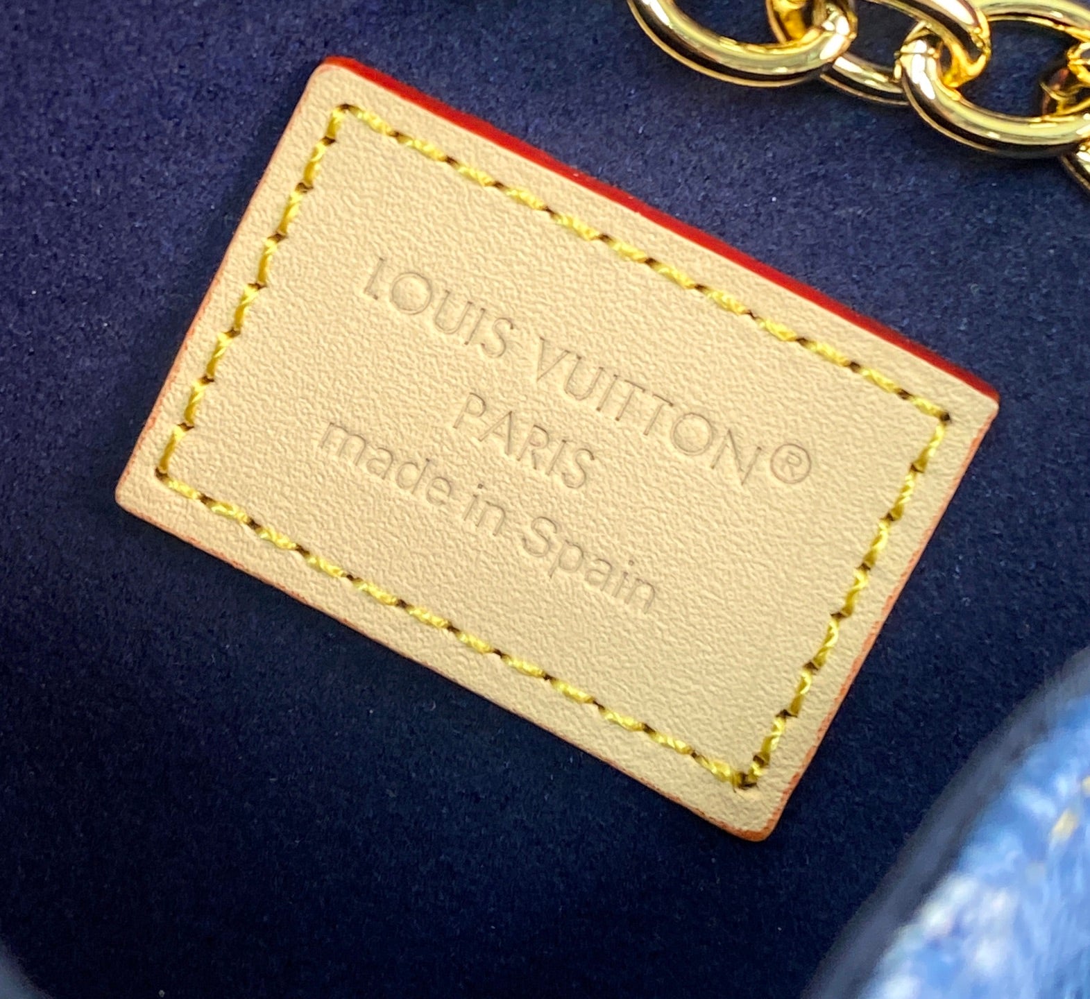 Louis Vuitton small bag leather label with Paris and made in Spain text