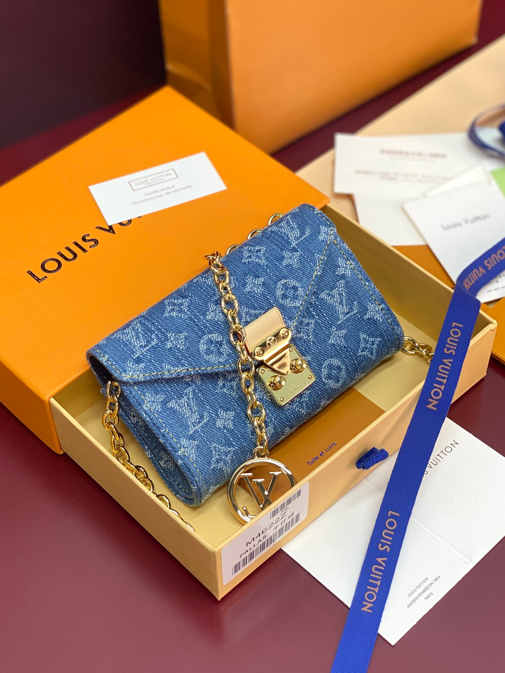 Blue monogram flap shoulder bag with gold chain strap and clasp closure