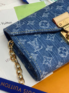 Blue monogram canvas mini bag with gold clasp and chain strap