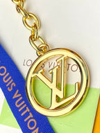 Small bag gold-tone round LV charm with chain and blue strap