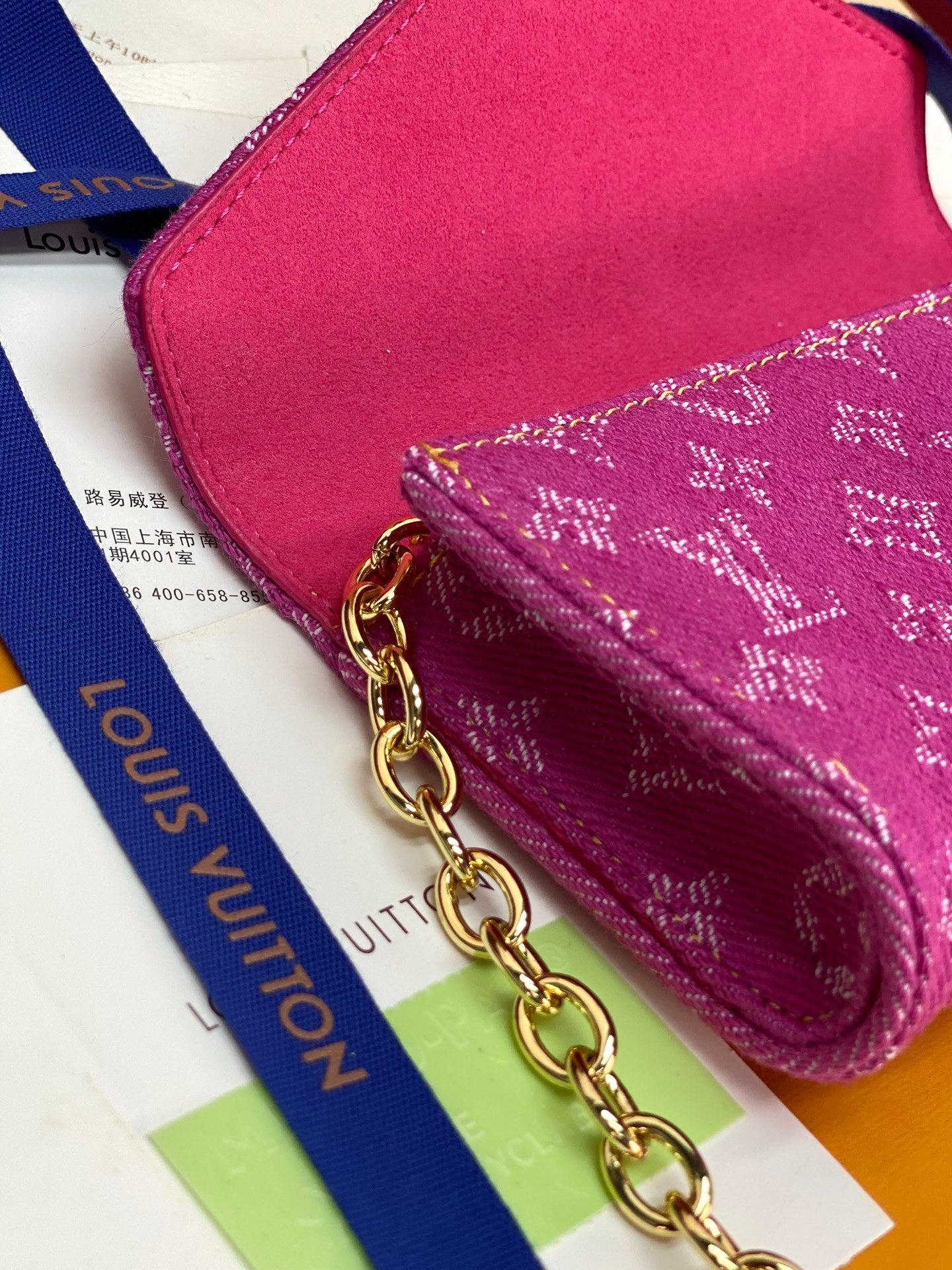 Louis Vuitton small bag chain strap with gold links over pink monogram canvas