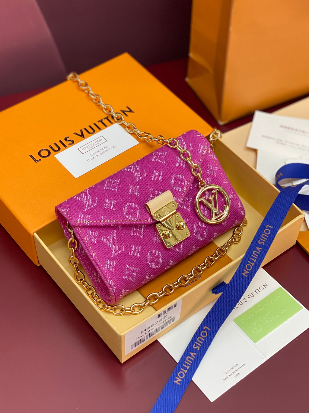 Purple monogram mini flap bag with gold chain strap and gold clasp hardware