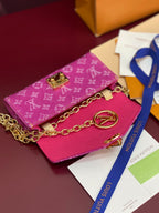 Louis Vuitton small bag in pink monogram canvas with gold flap clasp and chain strap