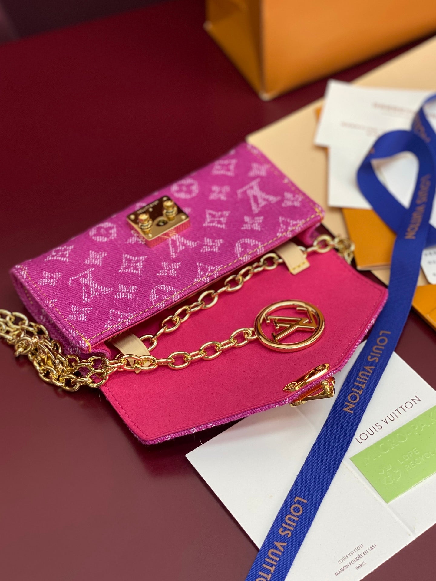 Louis Vuitton small bag in pink monogram canvas with gold flap clasp and chain strap