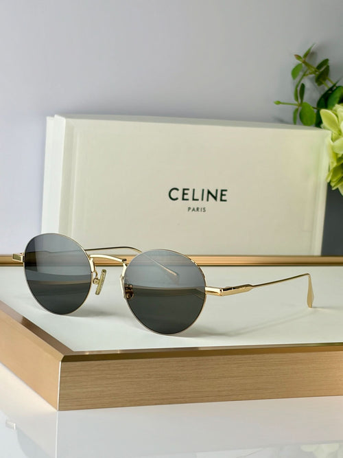 Celine round glasses with gold metal frame and dark green-tinted lenses