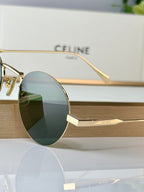 Celine round glasses close-up: gold frame and green-tinted lens