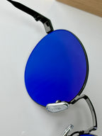 Round sunglasses with blue-tinted lenses and black temple arms