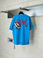 Blue graphic T-shirt with back print featuring a soccer ball graphic and text
