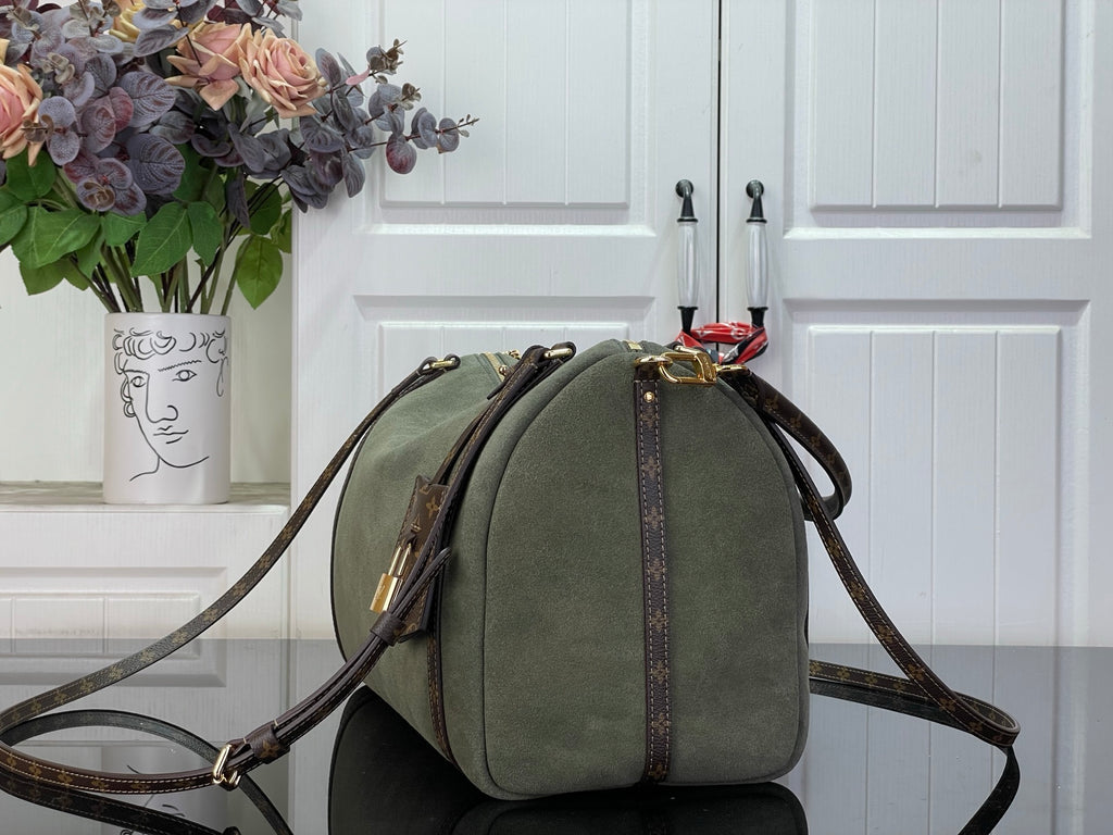 Louis Vuitton hobo bag in olive green with brown monogram side straps and top bow