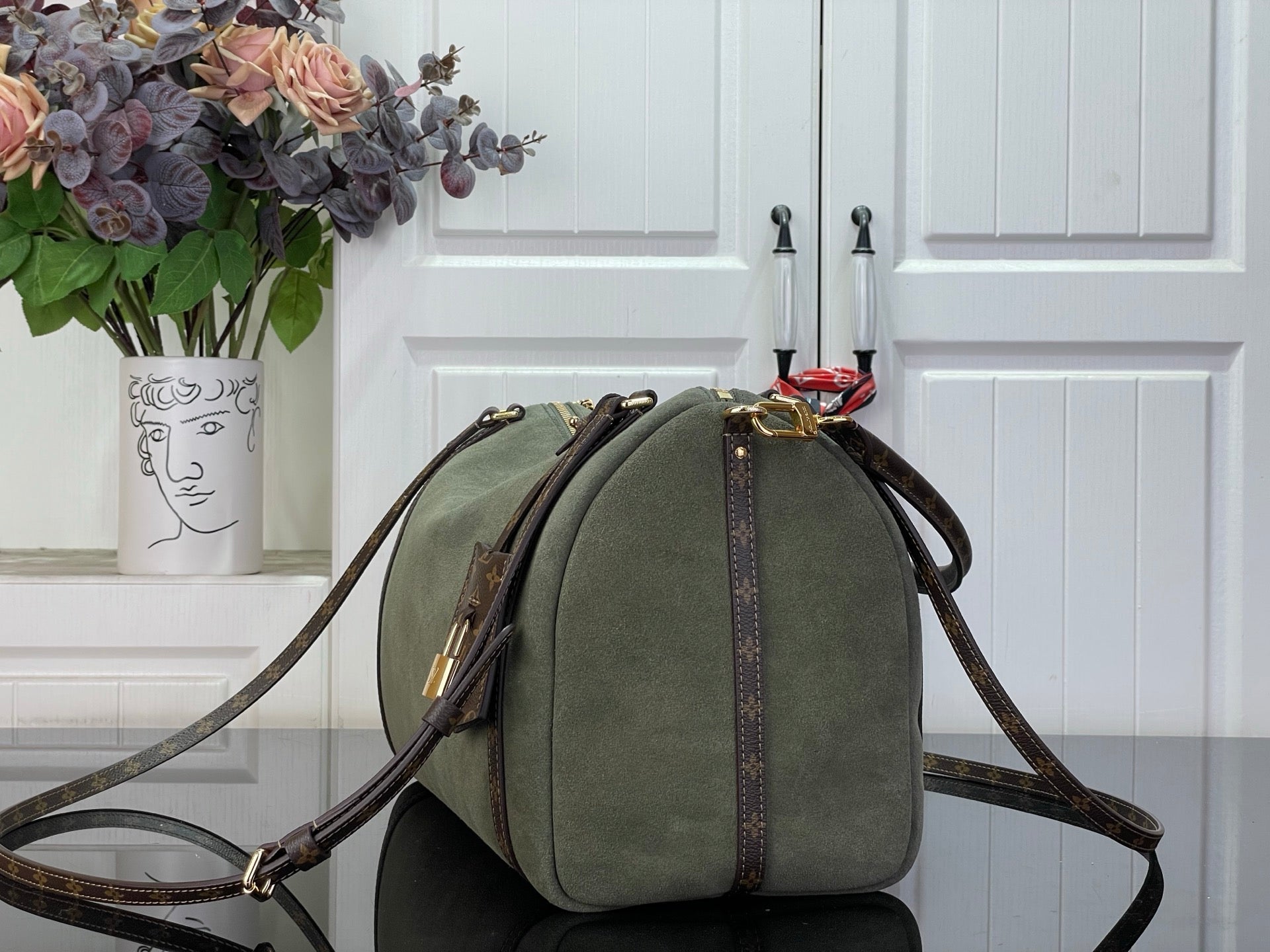 Louis Vuitton hobo bag in olive green with brown monogram side straps and top bow