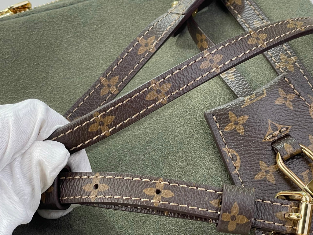 Louis Vuitton handle strap detail with monogram canvas and stitched edges on olive bag