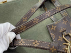 Louis Vuitton handle strap detail with monogram canvas and stitched edges on olive bag