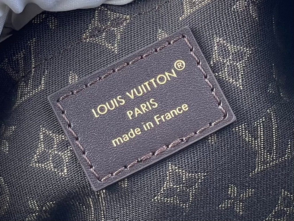 Louis Vuitton Paris made in France leather logo patch on dark monogram fabric