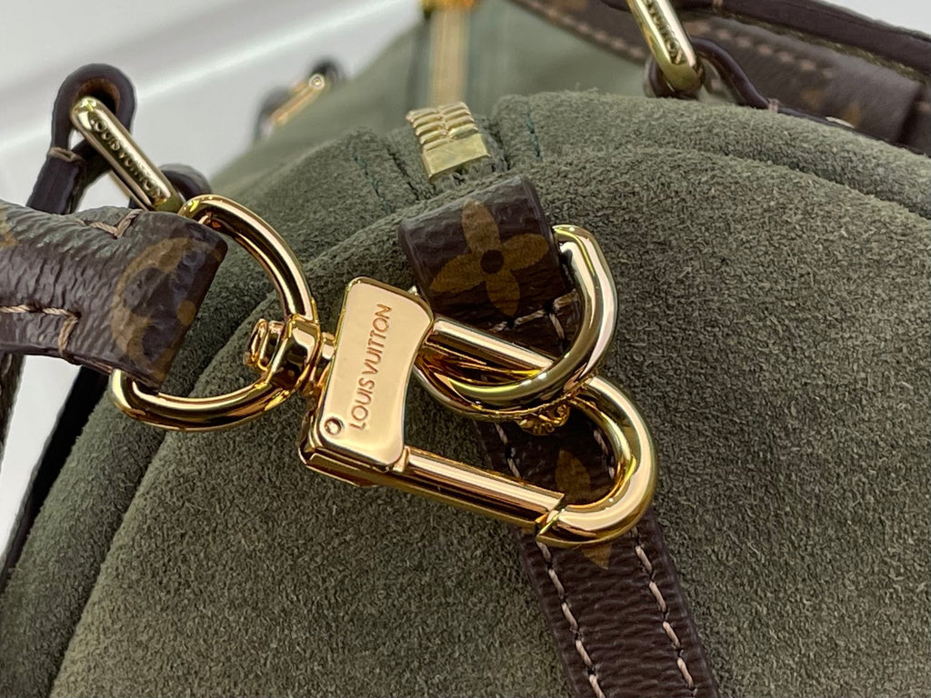 Louis Vuitton clasp detail: gold hook on olive green bag with monogram strap