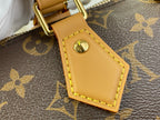 Louis Vuitton leather luggage tag with yellow stitching and gold-tone clasp